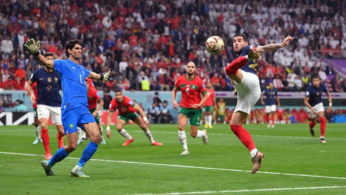 AL KHOR, QATAR - DECEMBER 14: Theo Hernandez of France scores the teams first goal past Yassine Bounou of Morocco during the FIFA World Cup Qatar 2022 semi final match between France and Morocco at Al Bayt Stadium on December 14, 2022 in Al Khor, Qatar. (Photo by Dan Mullan/Getty Images)