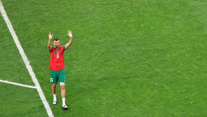 AL KHOR, QATAR - DECEMBER 14: Romain Saïss of Morocco (L) and Achraf Hakimi of Morocco after the FIFA World Cup Qatar 2022 semi final match between France and Morocco at Al Bayt Stadium on December 14, 2022 in Al Khor, Qatar. (Photo by Sebastian Frej/MB Media/Getty Images)