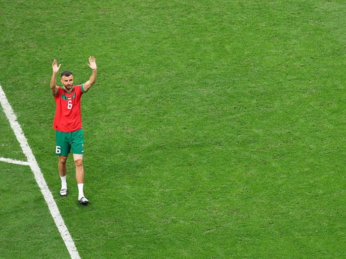 AL KHOR, QATAR - DECEMBER 14: Romain Saïss of Morocco (L) and Achraf Hakimi of Morocco after the FIFA World Cup Qatar 2022 semi final match between France and Morocco at Al Bayt Stadium on December 14, 2022 in Al Khor, Qatar. (Photo by Sebastian Frej/MB Media/Getty Images)