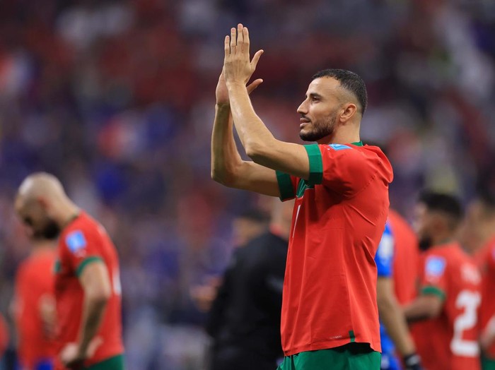 AL KHOR, QATAR - DECEMBER 14: Romain Saïss of Morocco (L) and Achraf Hakimi of Morocco after the FIFA World Cup Qatar 2022 semi final match between France and Morocco at Al Bayt Stadium on December 14, 2022 in Al Khor, Qatar. (Photo by Sebastian Frej/MB Media/Getty Images)