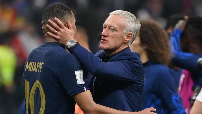 Frances coach Didier Deschamps embraces Frances forward #10 Kylian Mbappe at the end of the Qatar 2022 World Cup semi-final football match between France and Morocco at the Al-Bayt Stadium in Al Khor, north of Doha on December 14, 2022. (Photo by FRANCK FIFE / AFP) (Photo by FRANCK FIFE/AFP via Getty Images)
