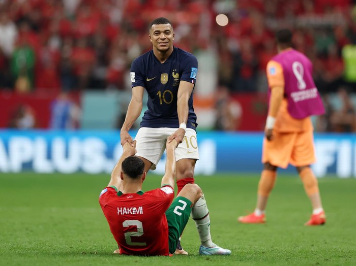 AL KHOR, QATAR - DECEMBER 14: Achraf Hakimi of Morocco embraces Kylian Mbappe of France after the FIFA World Cup Qatar 2022 semi final match between France and Morocco at Al Bayt Stadium on December 14, 2022 in Al Khor, Qatar. (Photo by Lars Baron/Getty Images)