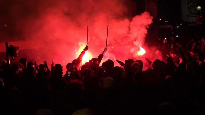 PARIS, FRANCE - DECEMBER 15: Fans of France celebrate victory after France defeated Morocco in FIFA World Cup Qatar 2022 semi-final match at Champs Elysees in Paris, France on December 15, 2022. (Photo by Dursun Aydemir/Anadolu Agency via Getty Images)