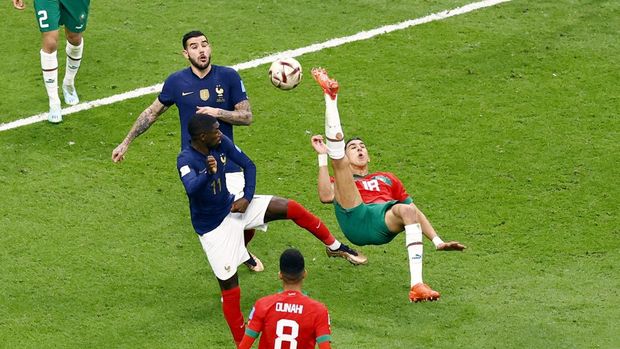 Soccer Football - FIFA World Cup Qatar 2022 - Semi Final - France v Morocco - Al Bayt Stadium, Al Khor, Qatar - December 14, 2022 Morocco's Jawad El Yamiq shoots at goal REUTERS/Peter Cziborra