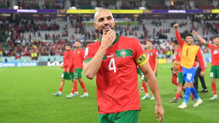 DOHA, QATAR - DECEMBER 10: Sofyan Amrabat of Morocco celebrates at the end of the FIFA World Cup Qatar 2022 quarter final match between Morocco/Spain and Portugal/Switzerland at Al Thumama Stadium on December 10, 2022 in Doha, Qatar. (Photo by Mike Hewitt - FIFA/FIFA via Getty Images)