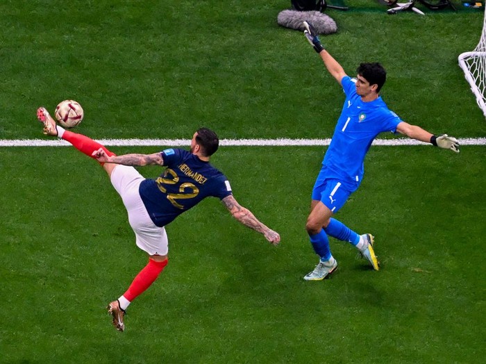 France's defender #22 Theo Hernandez scores a goal during the Qatar 2022 World Cup football semi-final match between France and Morocco at the Al-Bayt Stadium in Al Khor, north of Doha on December 14, 2022. (Photo by Antonin THUILLIER / AFP) (Photo by ANTONIN THUILLIER/AFP via Getty Images)