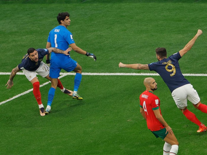 France's defender #22 Theo Hernandez (L) celebrates scoring his team's first goal with France's forward #09 Olivier Giroud during the Qatar 2022 World Cup semi-final football match between France and Morocco at the Al-Bayt Stadium in Al Khor, north of Doha on December 14, 2022. (Photo by Odd ANDERSEN / AFP) (Photo by ODD ANDERSEN/AFP via Getty Images)