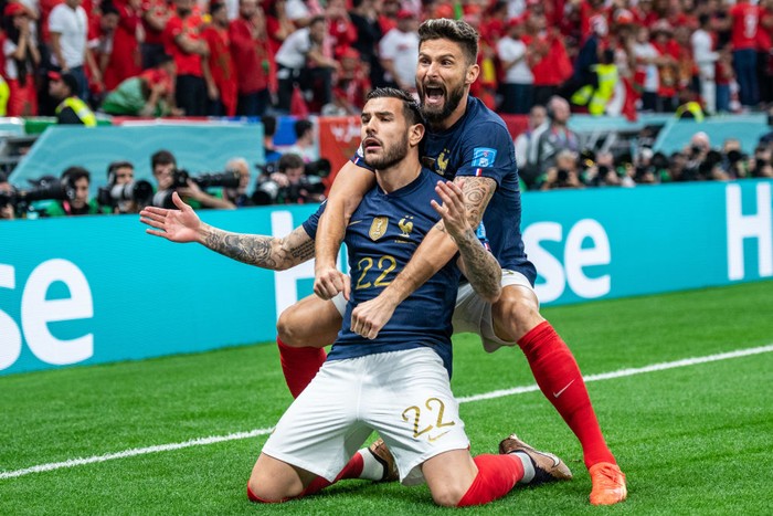 AL KHOR, QATAR - DECEMBER 14: Theo Hernandez of France celebrates with Olivier Giroud after scoring opening goal during the FIFA World Cup Qatar 2022 semi final match between France and Morocco at Al Bayt Stadium on December 14, 2022 in Al Khor, Qatar. (Photo by Sebastian Frej/MB Media/Getty Images)