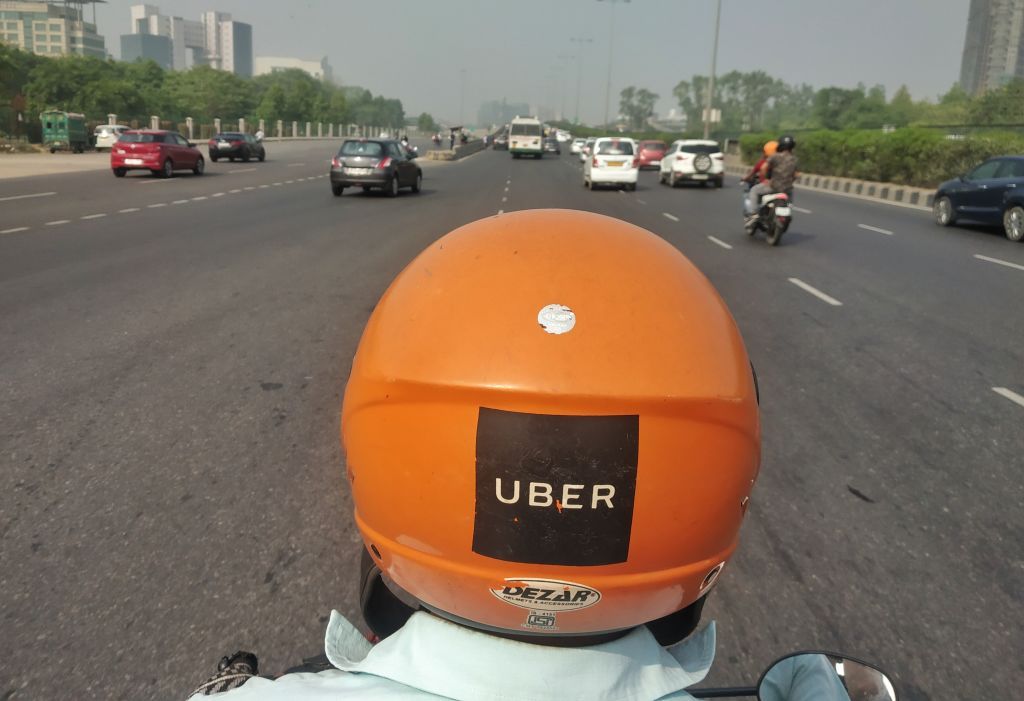 An Uber Moto Rider moves through Gurugram in Haryana, India, on June 25, 2019. (Photo by Nasir Kachroo/NurPhoto via Getty Images)
