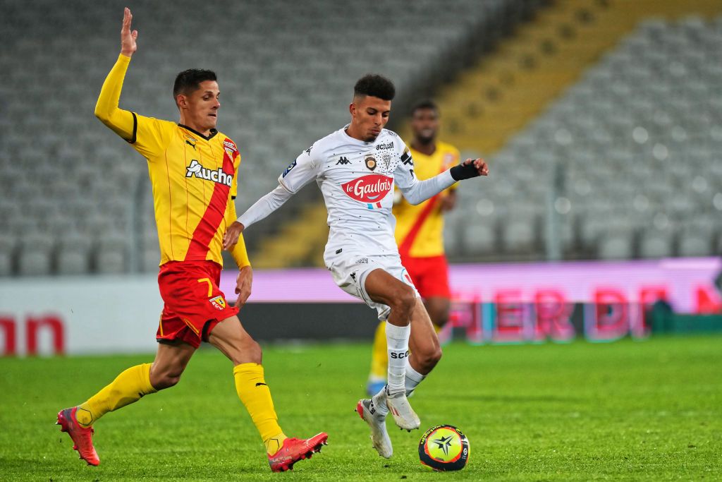 LENS, FRANCE - NOVEMBER 28: RC Lens's Florian Sotoca competes for the ball with Angers SCO's Azzedine Ounahi during the Ligue 1 Uber Eats match between RC Lens and Angers SCO at Stade Bollaert-Delelis on November 26, 2021 in Lens, France.  (Photo by Sylvain Lefevre/Getty Images)