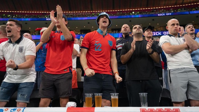 AL KHOR, QATAR - DECEMBER 10: England fans cheer during a FIFA World Cup Qatar 2022 Quarter-final game between France and England at Al Bayt Stadium on December 10, 2022 in Al Khor, Qatar. (Photo by Stephen Nadler/ISI Photos/Getty Images)