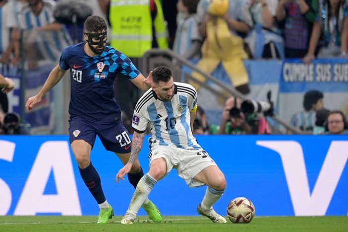 LUSAIL, QATAR - DECEMBER 13: (L-R) Josko Gvardiol of Croatia, Lionel Messi of Argentina  during the  World Cup match between Argentina  v Croatia at the Lusail Stadium on December 13, 2022 in Lusail Qatar (Photo by Dale MacMilan/Soccrates/Getty Images)