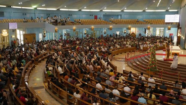 People take part in a liturgy at the Catholic Church, Our Lady of the Rosary, at the Religious complex, in Doha, Qatar, Friday, Dec. 9, 2022. (AP Photo/Thanassis Stavrakis)