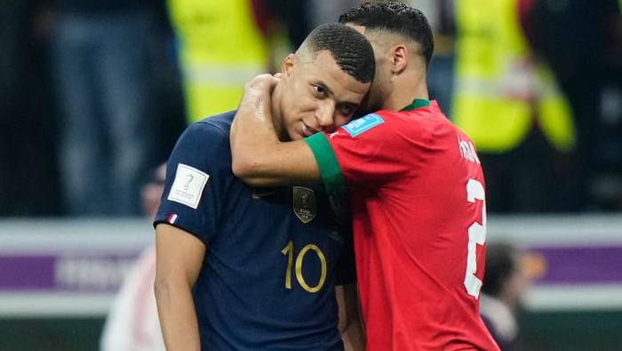 Kylian Mbappe centre-forward of France and Paris Saint-Germain and Achraf Hakimi right-back of Morocco and Paris Saint-Germain greet each other after the FIFA World Cup Qatar 2022 semi final match between France and Morocco at Al Bayt Stadium on December 14, 2022 in Al Khor, Qatar. (Photo by Jose Breton/Pics Action/NurPhoto via Getty Images)