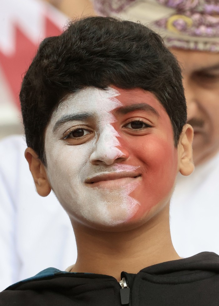 QATAR - NOVEMBER 25: A child fan of Qatar in the stands during FIFA World Cup 2022 in Qatar on November 25, 2022. (Photo by Mohammed Dabbous/Anadolu Agency via Getty Images)