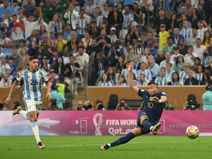 LUSAIL CITY, QATAR - DECEMBER 18: Kylian Mbappe of France scores the team's second goal during the FIFA World Cup Qatar 2022 Final match between Argentina and France at Lusail Stadium on December 18, 2022 in Lusail City, Qatar. (Photo by Mike Hewitt - FIFA/FIFA via Getty Images)