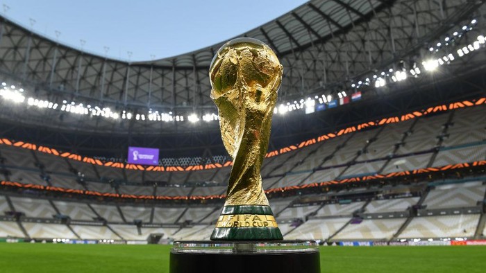 LUSAIL CITY, QATAR - DECEMBER 14: The World Cup trophy pictured inside Lusail Stadium on December 14, 2022 in Lusail City, Qatar. (Photo by David Ramos - FIFA/FIFA via Getty Images)USAGE INSTRUCTIONSThe FIFA World Cup Winners trophy is FIFA’s IP and use of this images must be approved by FIFA.  Furthermore, all uses and publications of this image must not crop the plinth, the designation on the plinth must remain fully legible.