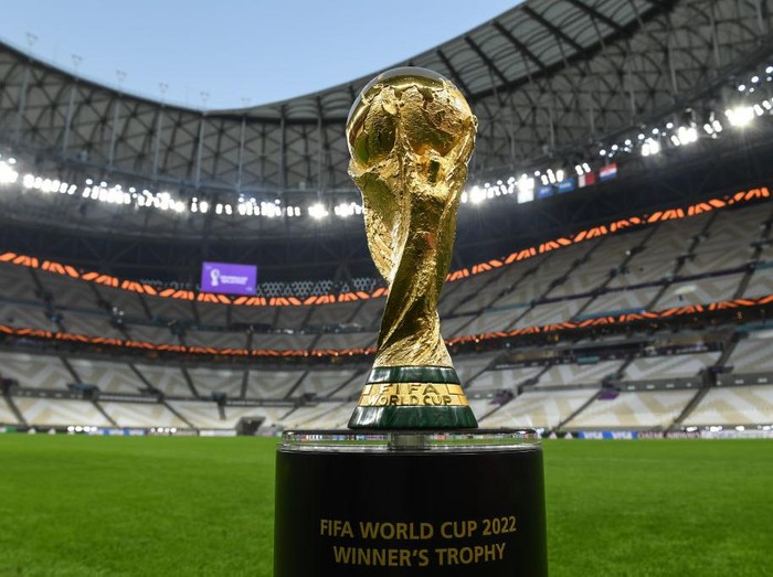 LUSAIL CITY, QATAR - DECEMBER 14: The World Cup trophy pictured inside Lusail Stadium on December 14, 2022 in Lusail City, Qatar. (Photo by David Ramos - FIFA/FIFA via Getty Images)USAGE INSTRUCTIONSThe FIFA World Cup Winner's trophy is FIFA’s IP and use of this images must be approved by FIFA.  Furthermore, all uses and publications of this image must not crop the plinth, the designation on the plinth must remain fully legible.