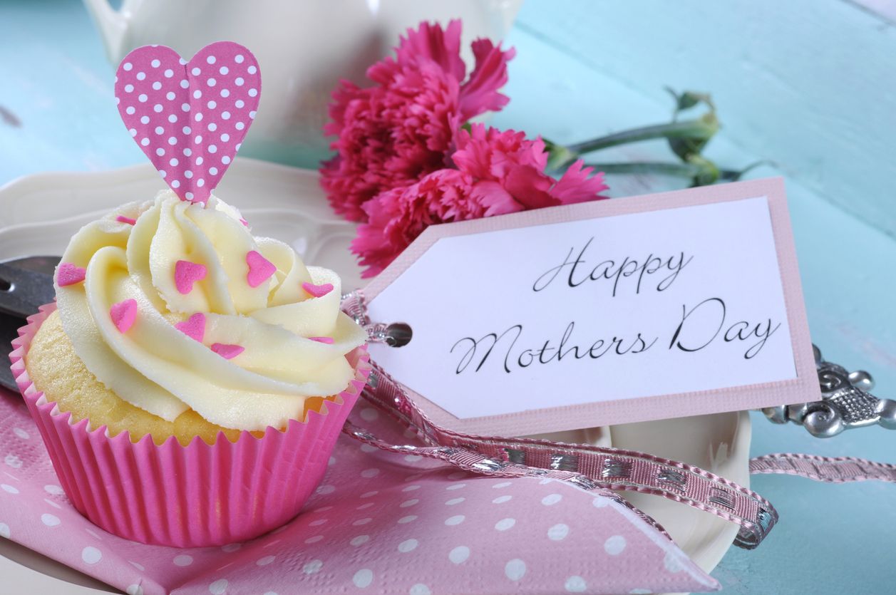 Happy Mothers Day aqua blue vintage retro shaby chic tray with pink cupcake close up with pink hearts and ribbon decoration and gift tag