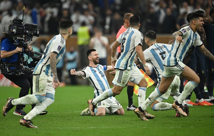 Soccer Football - FIFA World Cup Qatar 2022 - Final - Argentina v France - Lusail Stadium, Lusail, Qatar - December 18, 2022  Argentinas Lionel Messi celebrates with Leandro Paredes after winning the World Cup REUTERS/Dylan Martinez