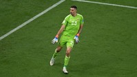 Emi Martinez adalah orang yang sangat positif dan dia memberi tahu rekan-rekannya, dia akan menggagalkan sejumlah penalti, ujar Pelatih Argentina Lionel Scaloni dikutip BBC. (Foto: dpa/picture alliance via Getty I/picture alliance)