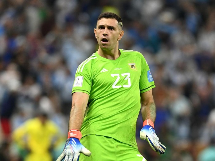 LUSAIL CITY, QATAR - DECEMBER 18: Emiliano Martinez of Argentina celebrates as Aurelien Tchouameni of France misses the team's third penalty in the penalty shoot out during the FIFA World Cup Qatar 2022 Final match between Argentina and France at Lusail Stadium on December 18, 2022 in Lusail City, Qatar. (Photo by David Ramos - FIFA/FIFA via Getty Images)