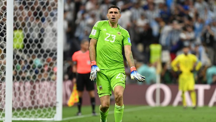 LUSAIL CITY, QATAR - DECEMBER 18: Emiliano Martinez of Argentina celebrates as Aurelien Tchouameni of France misses the teams third penalty in the penalty shoot out during the FIFA World Cup Qatar 2022 Final match between Argentina and France at Lusail Stadium on December 18, 2022 in Lusail City, Qatar. (Photo by David Ramos - FIFA/FIFA via Getty Images)