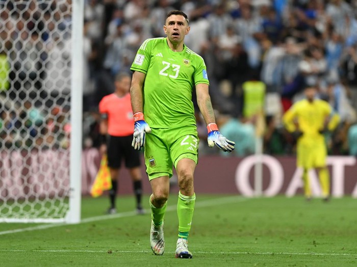 LUSAIL CITY, QATAR - DECEMBER 18: Emiliano Martinez of Argentina celebrates as Aurelien Tchouameni of France misses the team's third penalty in the penalty shoot out during the FIFA World Cup Qatar 2022 Final match between Argentina and France at Lusail Stadium on December 18, 2022 in Lusail City, Qatar. (Photo by David Ramos - FIFA/FIFA via Getty Images)