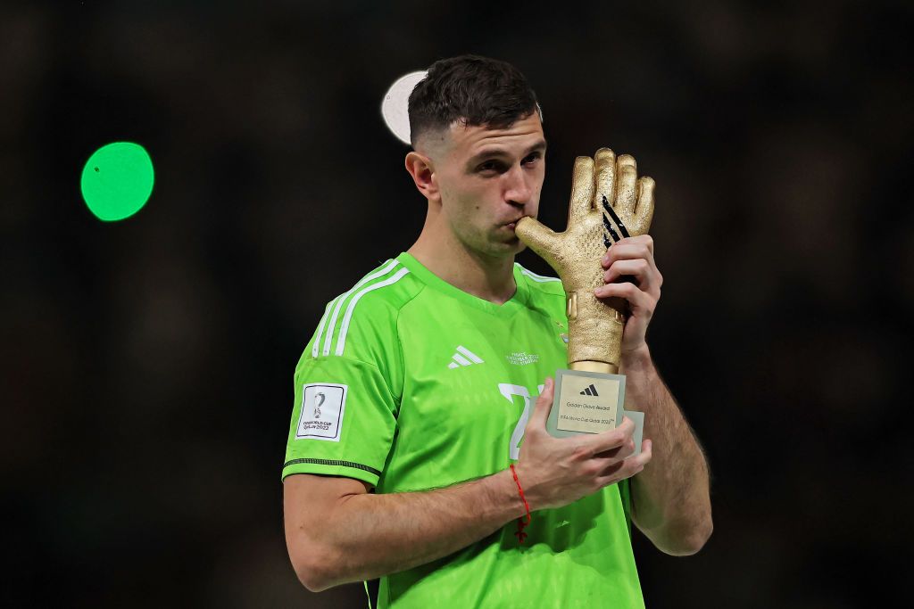 LUSAIL CITY, QATAR - DECEMBER 18: Goalkeeper Emiliano Martinez of Argentina poses for photos with his best goalkeeper trophy during the FIFA World Cup Qatar 2022 Final match between Argentina and France at Lusail Stadium on December 18, 2022 in Lusail City, Qatar. (Photo by Heuler Andrey/Eurasia Sport Images/Getty Images)