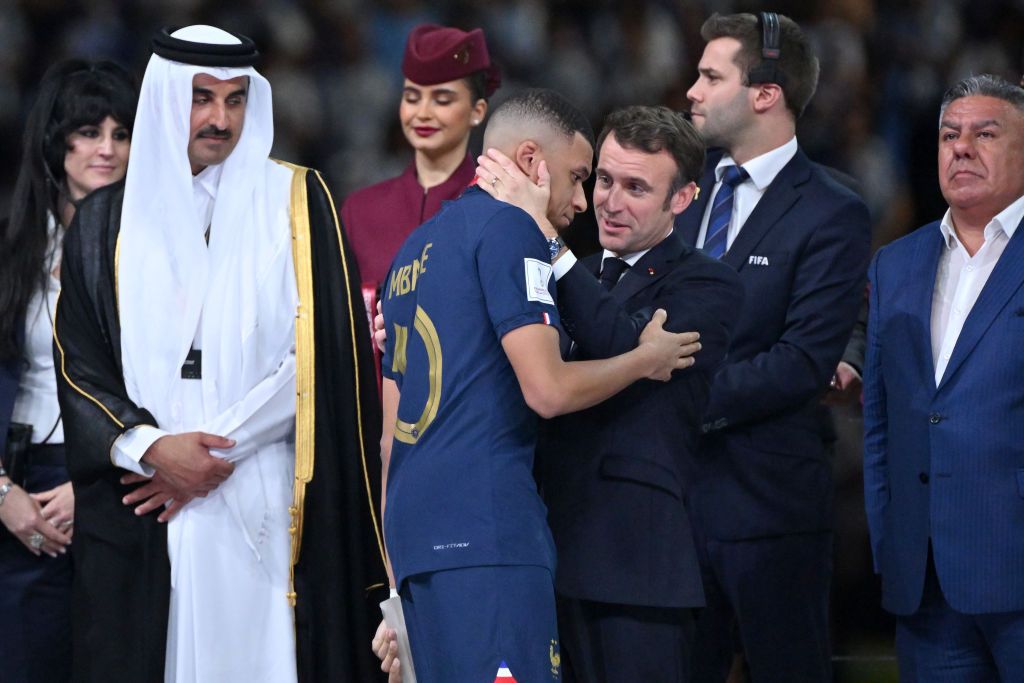 LUSAIL CITY, QATAR - DECEMBER 18: Kylian Mbappe of France is consoled by Emmanuel MacronPresident of France after defeat in the FIFA World Cup Qatar 2022 Final match between Argentina and France at Lusail Stadium on December 18, 2022 in Lusail City, Qatar. (Photo by Richard Sellers/Getty Images)