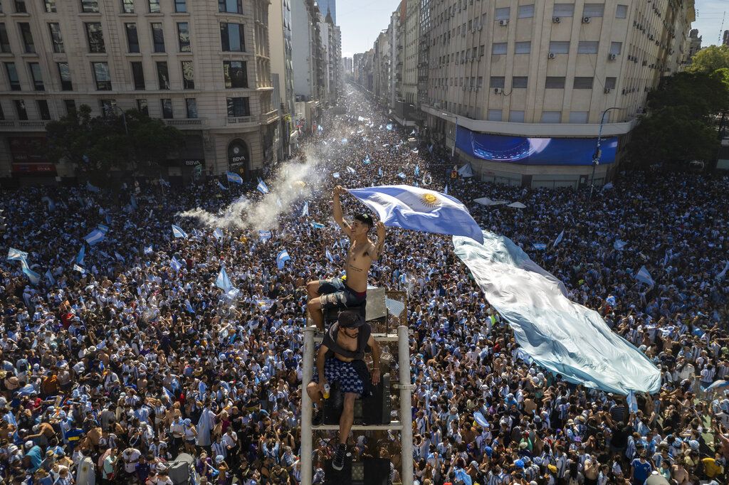 Argentine soccer fans react to France scoring a goal during the World Cup final soccer match between Argentina and France in Buenos Aires, Argentina, Sunday, Dec. 18, 2022. (AP Photo/Rodrigo Abd)