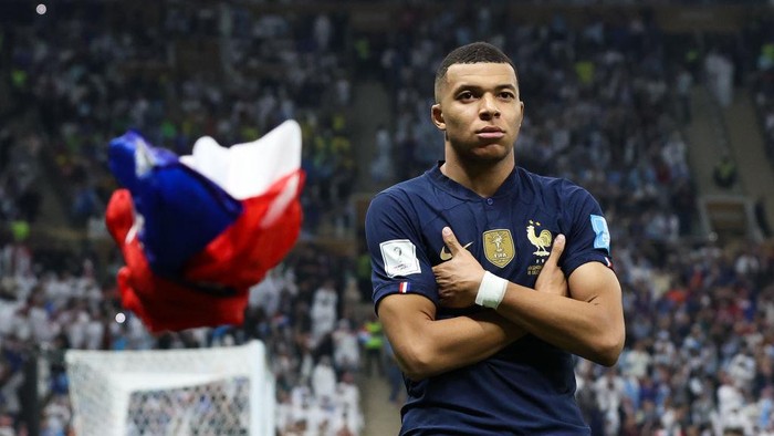LUSAIL CITY, QATAR - DECEMBER 18: Kylian Mbappe of France celebrates after scoring his sides third goal during the FIFA World Cup Qatar 2022 Final match between Argentina and France at Lusail Stadium on December 18, 2022 in Lusail City, Qatar. (Photo by Alex Livesey - Danehouse/Getty Images)