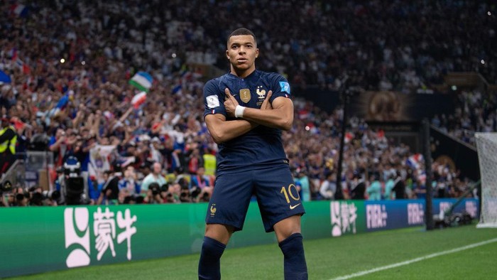 LUSAIL CITY, QATAR - DECEMBER 18: Kylian Mbappe of France celebrates scoring their third goal during the FIFA World Cup Qatar 2022 Final match between Argentina and France at Lusail Stadium on December 18, 2022 in Lusail City, Qatar. (Photo by Visionhaus/Getty Images)