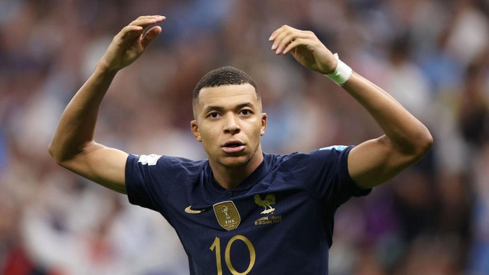 LUSAIL CITY, QATAR - DECEMBER 18: Kylian Mbappe of France celebrates after scoring the teams third goal and their hat trick from the penalty spot during the FIFA World Cup Qatar 2022 Final match between Argentina and France at Lusail Stadium on December 18, 2022 in Lusail City, Qatar. (Photo by Catherine Ivill/Getty Images)