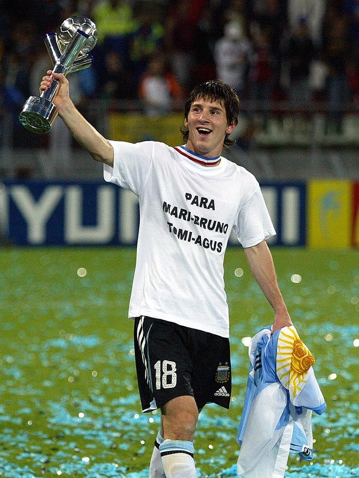 Lionel Messi Utrecht, NETHERLANDS: Argentina's Lionel Messi holds the trophy after the final football match against Nigeria for the FIFA World Youth Championship in Utrecht, Netherlands, 02 July 2005. AFP PHOTO / Aris Messinis (Photo credit should read ARIS MESSINIS/AFP via Getty Images)