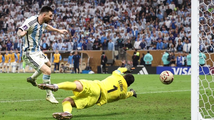 LUSAIL CITY, QATAR - DECEMBER 18: Lionel Messi of Argentina scores a goal to make it 3-2 during the FIFA World Cup Qatar 2022 Final match between Argentina and France at Lusail Stadium on December 18, 2022 in Lusail City, Qatar. (Photo by Matthew Ashton - AMA/Getty Images)