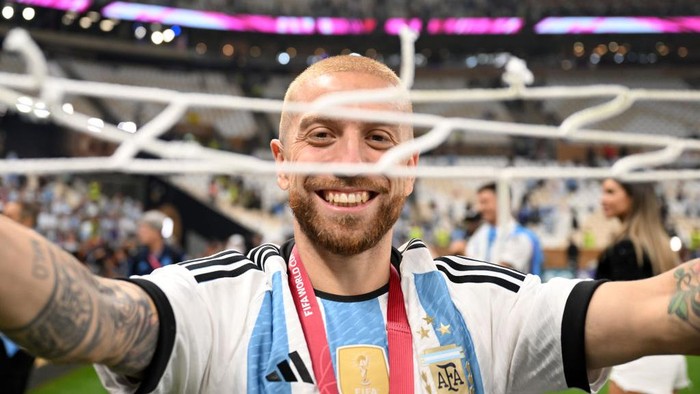 LUSAIL CITY, QATAR - DECEMBER 18: Alejandro Gomez of Argentina celebrates after the teams victory with a piece of the net during the FIFA World Cup Qatar 2022 Final match between Argentina and France at Lusail Stadium on December 18, 2022 in Lusail City, Qatar. (Photo by Michael Regan - FIFA/FIFA via Getty Images)