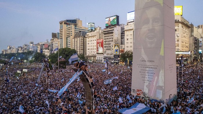 Argentine soccer fans crowd the capital's Obelisk to celebrate their team's World Cup victory over France in Buenos Aires, Argentina, Sunday, Dec. 18, 2022. (AP Photo/Rodrigo Abd