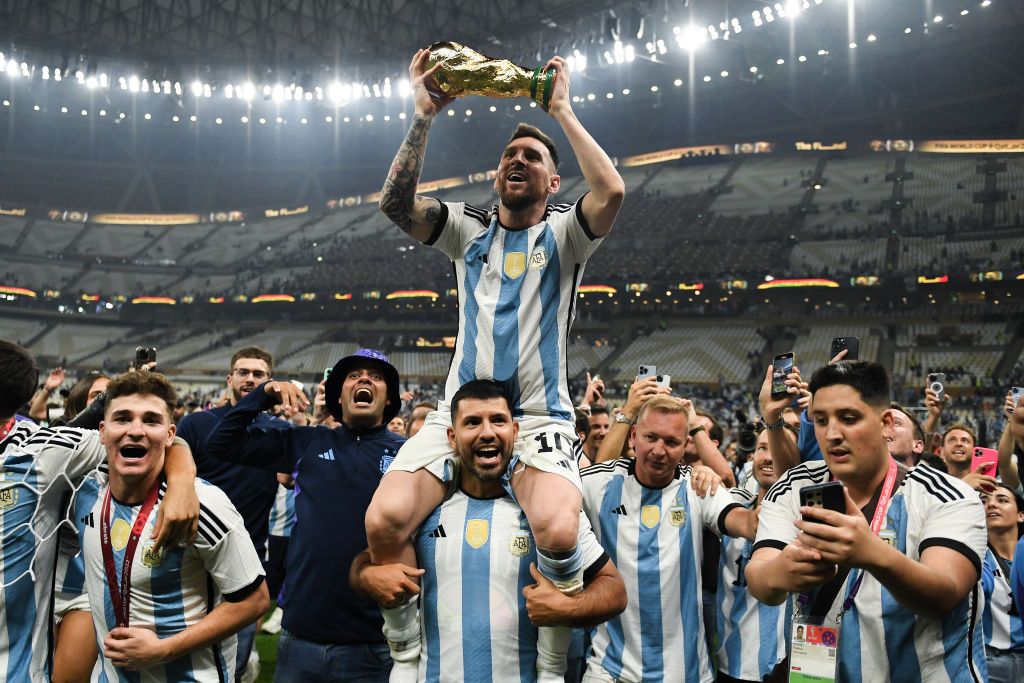 LUSAIL CITY, QATAR - DECEMBER 18: Sergio Aguero lifts and celebrates with the World Cup Trophy during the FIFA World Cup Qatar 2022 Final match between Argentina and France at Lusail Stadium on December 18, 2022 in Lusail City, Qatar. (Photo by Marc Atkins/Getty Images)