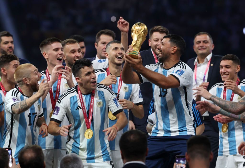 LUSAIL CITY, QATAR - DECEMBER 18: Sergio Aguero lifts and celebrates with the World Cup Trophy during the FIFA World Cup Qatar 2022 Final match between Argentina and France at Lusail Stadium on December 18, 2022 in Lusail City, Qatar. (Photo by Marc Atkins/Getty Images)