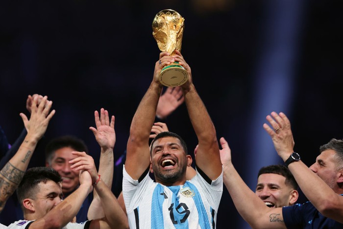 LUSAIL CITY, QATAR - DECEMBER 18: Sergio Aguero lifts and celebrates with the World Cup Trophy during the FIFA World Cup Qatar 2022 Final match between Argentina and France at Lusail Stadium on December 18, 2022 in Lusail City, Qatar. (Photo by Marc Atkins/Getty Images)