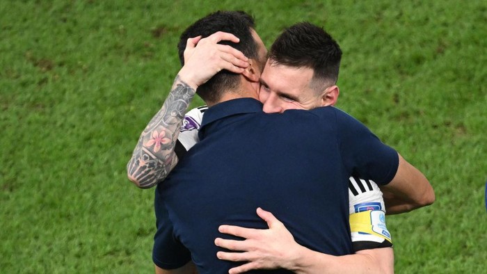 13 December 2022, Qatar, Lusail: Soccer, World Cup, Argentina - Croatia, final round, semifinal, Lusail Stadium, Argentinas Lionel Messi hugs Argentinas coach Lionel Scaloni after the match. Photo: Robert Michael/dpa (Photo by Robert Michael/picture alliance via Getty Images)