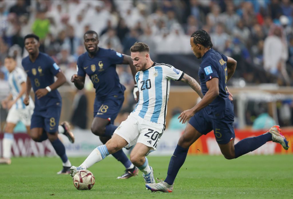 LUSAIL CITY, QATAR - DECEMBER 18: Alexis Mac Allister of Argentina kisses the FIFA World Cup Qatar 2022 Winner's Trophy during the FIFA World Cup Qatar 2022 Final match between Argentina and France at Lusail Stadium on December 18, 2022 in Lusail City, Qatar. (Photo by Clive Brunskill/Getty Images)