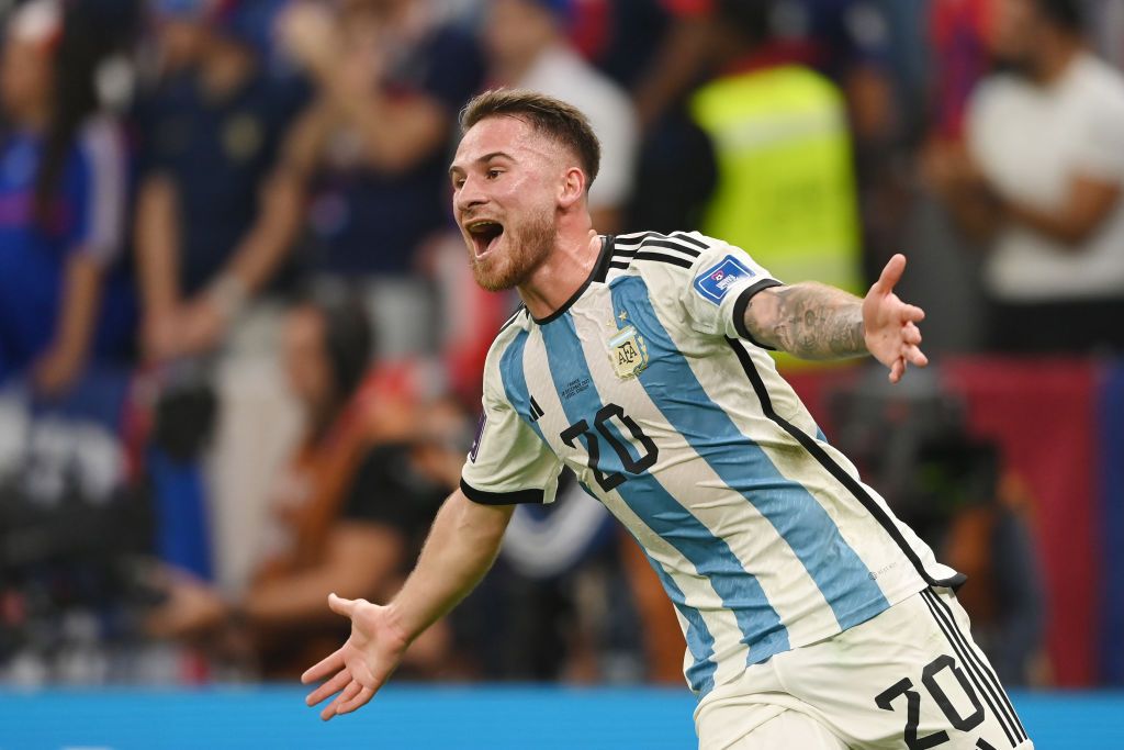 LUSAIL CITY, QATAR - DECEMBER 18: Alexis Mac Allister of Argentina kisses the FIFA World Cup Qatar 2022 Winner's Trophy during the FIFA World Cup Qatar 2022 Final match between Argentina and France at Lusail Stadium on December 18, 2022 in Lusail City, Qatar. (Photo by Clive Brunskill/Getty Images)