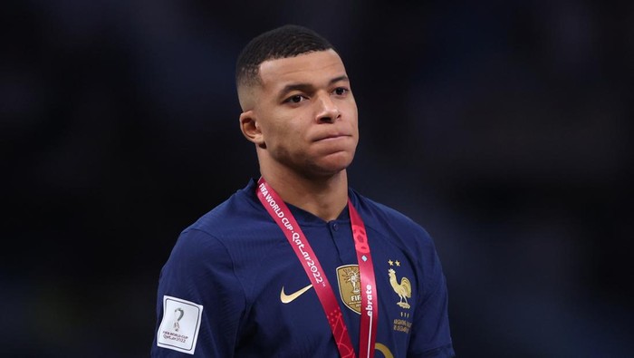 LUSAIL CITY, QATAR - DECEMBER 18: Kylian Mbappe of France looks dejected after collecting his golden boot award after the FIFA World Cup Qatar 2022 Final match between Argentina and France at Lusail Stadium on December 18, 2022 in Lusail City, Qatar. (Photo by Marc Atkins/Getty Images)