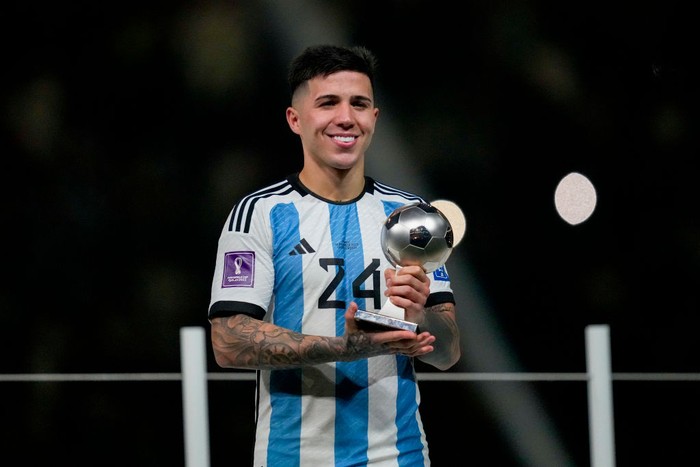 Enzo Fernandez LUSAIL CITY, QATAR - DECEMBER 18: Enzo Fernandez of Argentina with the trophy for the best young player after the FIFA World Cup Qatar 2022 Final match between Argentina and France at Lusail Stadium on December 18, 2022 in Lusail City, Qatar. (Photo by Ulrik Pedersen/Defodi Images via Getty Images)