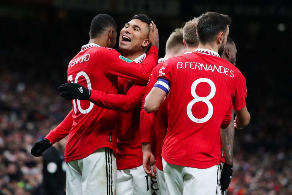 MANCHESTER, ENGLAND - DECEMBER 21: Marcus Rashford of Manchester United celebrates with Casemiro after scoring his side's second goal during the Carabao Cup Fourth Round match between Manchester United and Burnley at Old Trafford on December 21, 2022 in Manchester, England. (Photo by James Gill - Danehouse/Getty Images)
