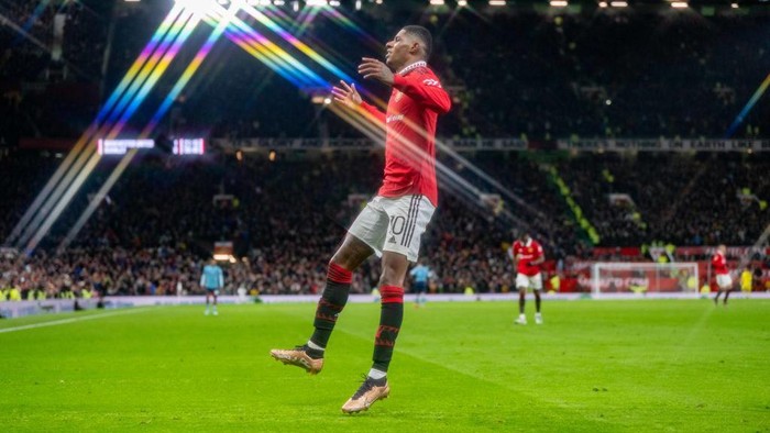 MANCHESTER, ENGLAND - DECEMBER 21:  Marcus Rashford of Manchester United celebrates scoring a goal to make it 2-0 during the Carabao Cup Fourth Round match between Manchester United and Burnley at Old Trafford on December 21, 2022 in Manchester, England. (Photo by Ash Donelon/Manchester United via Getty Images)