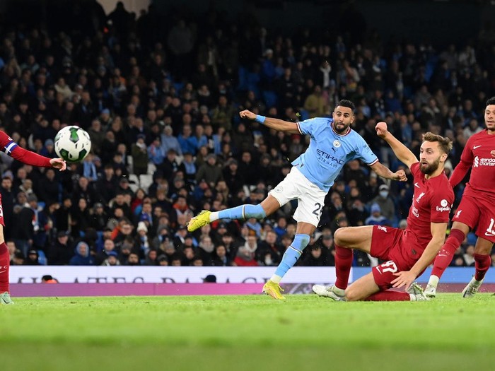 MANCHESTER, ENGLAND - DECEMBER 22: Riyad Mahrez of Manchester City scores his team's second goal of the game during the Carabao Cup Fourth Round match between Manchester City and Liverpool at Etihad Stadium on December 22, 2022 in Manchester, England. (Photo by Stu Forster/Getty Images)