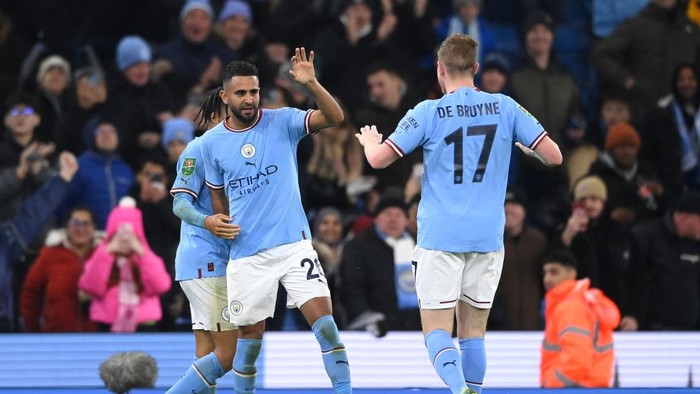 MANCHESTER, ENGLAND - DECEMBER 22: Riyad Mahrez of Manchester City celebrates with team mates after scoring his teams second goal of the game during the Carabao Cup Fourth Round match between Manchester City and Liverpool at Etihad Stadium on December 22, 2022 in Manchester, England. (Photo by Stu Forster/Getty Images)